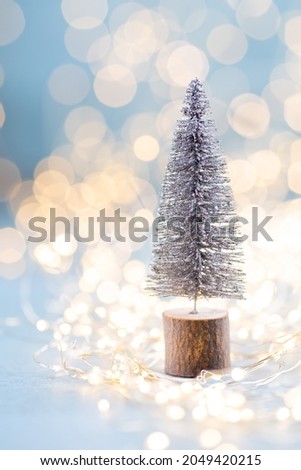 Christmas spruce with tree and blurred shiny lights.