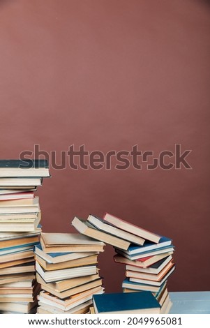 Stacks of Books for College Library Training Brown Background