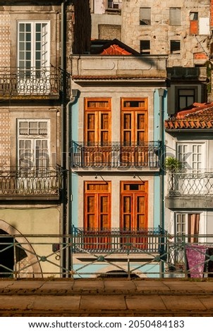 Cute little european houses stuck together typical old city view colorful facade of vintage buildings - Porto, Portugal