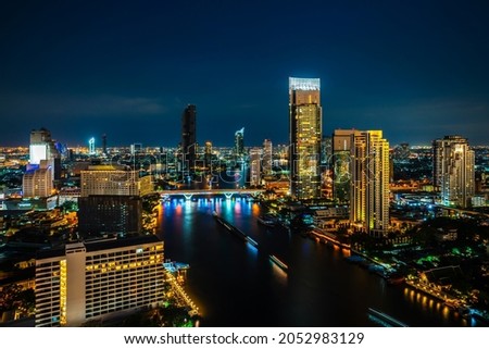 Night cityscape and high-rise buildings in metropolis city center . Downtown business district in panoramic view .