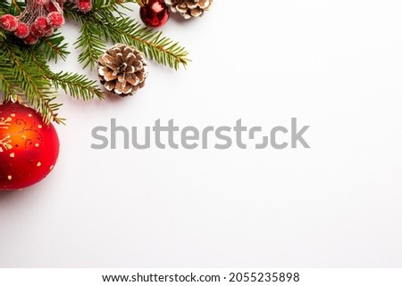 Christmas holidays composition with red balls on white background with copy space for your text