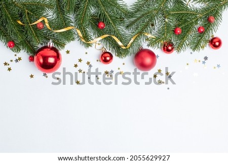 Christmas composition, a frame of Christmas tree branches and Christmas tree toys on a white background is isolated