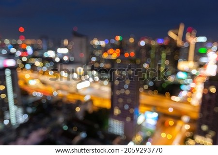 Footage scene of blurred defocused city shining and blinking light presenting at night time with bokeh 