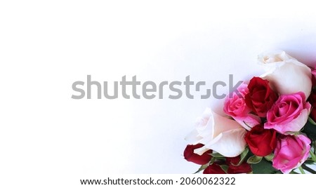 A bright festive bouquet of pink and burgundy roses on a white background. Background for greeting cards, invitations, greetings.