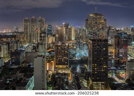 Modern Commercial City at night in Bangkok Thailand