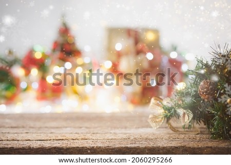 Christmas composition. rustic wood table in front of christmas light night,abstract circular bokeh background