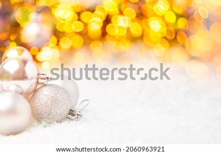 Two Christmas balls with bokeh light. Concept of post card for New Year holidays