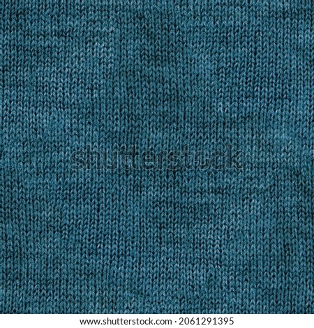 Real knitted fabric seamless pattern, texture, background. Blue green wool yarn
