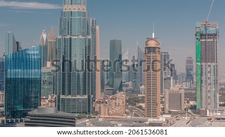 Aerial view of Dubai International Financial Centre DIFC district timelapse. Office towers and construction site with modern glass skyscrapers