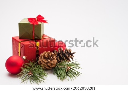 Christmas and New Year composition. Gift boxes with holiday packaging and decorations on a white background