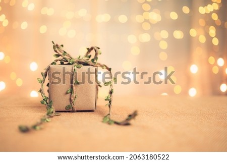 gift box, present on the table and light of bokeh background. Valentine's Day, Christmas, Birth day, New year and Anniversary concept.