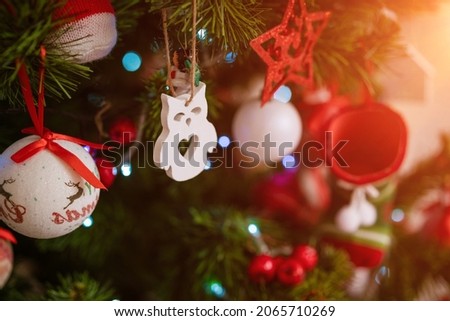 Beautiful christmas background, christmas toys and balls on the new year tree. Selective focus and soft light