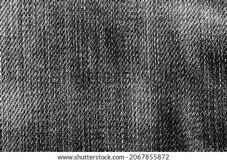 Dark black jeans texture and textile background.