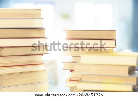 Stacks of books indoors. Bokeh effect 