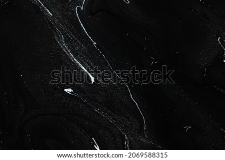 Black liquid marble background handmade acrylic paint