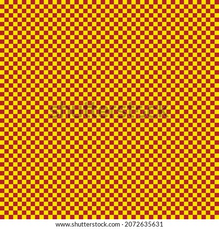 Checkerboard with very small squares. Fire brick and Yellow colors of checkerboard. Chessboard, checkerboard texture. Squares pattern. Background. Repeatable texture.
