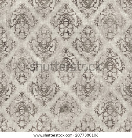 Seamless tan brown grungy tribal neutral rug motif surface pattern design for print. High quality illustration. Distressed bohemian ethnic repeat swatch. Hand drawn diamond damask textile design.