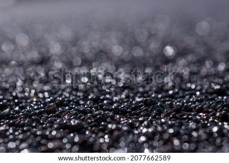  picture of the vulcanic black sand on the beach