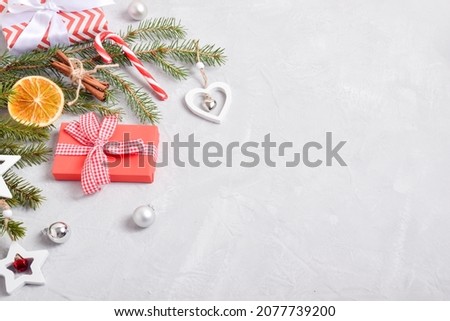 New Year's composition from the decor. Festive background for Christmas with a gift and decorations for . Space for copying. Flat position, top view.