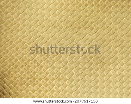 Metallized paper with fabric texture. Gold paper. Gold. Shiny paper.