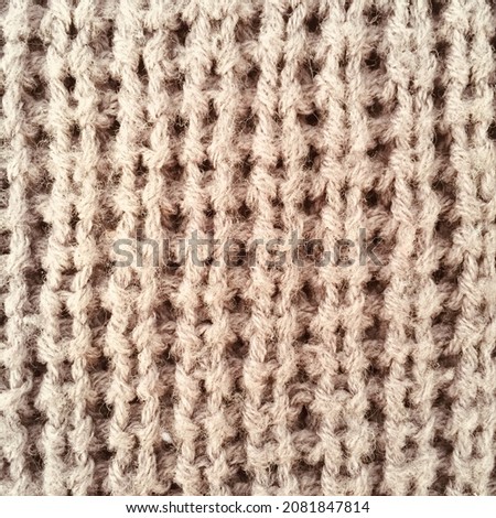 Background knitted thick wool fabric that is parallel and neat in gray.