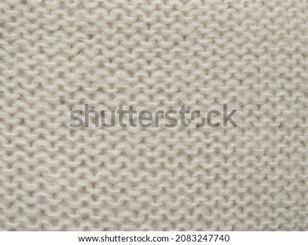Beige knitted fabric texture, garter stitch