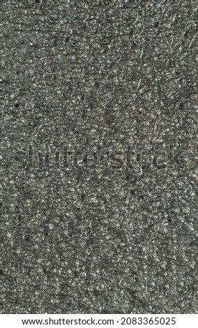 close up, background, texture, large long vertical banner. surface structure black expanded polyethylene, EPE, padding cushioning material for packages. full depth of field. high resolution photo
