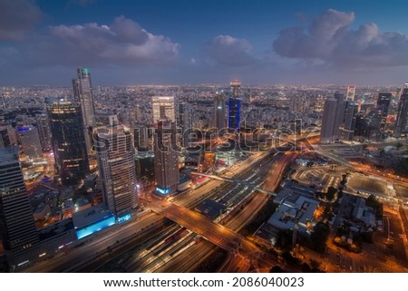 Tel Aviv evening view from above. Aerial panorama. Tall modern buildings