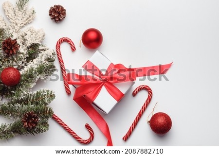Christmas or New Year background, plain composition made of decorations and fir branches, flat lay, top view, blank space for text