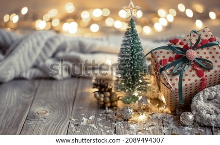 Christmas composition with a festive gift on a blurred background.