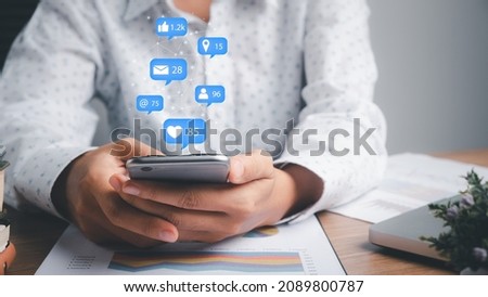 Woman using smart phone on office desk with copy space, Social, media, Marketing concept.	