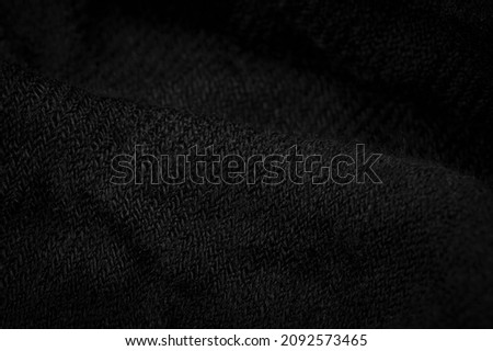Black rough woolen fabric. Sheep with long, durable, coarse-fiber wool, especially suited to your design. As with various large breeds of lamb of English origin. Texture background pattern