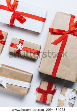 Vertical above view Christmas composition of decorated gift boxes on white background.