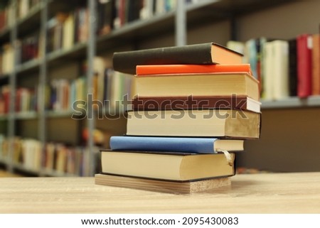 Books on the table in library. School books