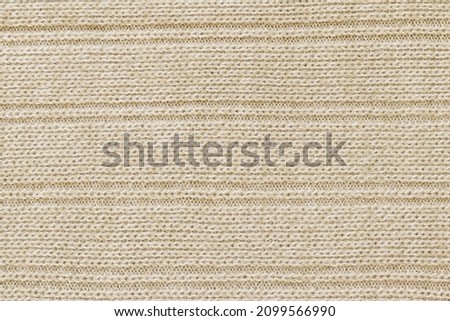 Light texture of sweater fabric. The fabric of the sweater is made of cotton. 