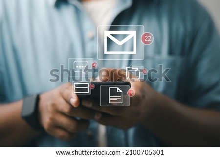 Businessman using smartphone to check email notification with icon or hologram. online communication technology concept
