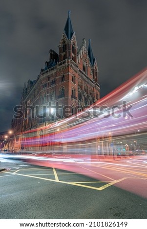 A vertical shot of the night street with light trails 
