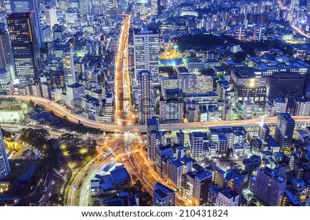 Tokyo, Japan cityscape over Roppongi Junction at night.