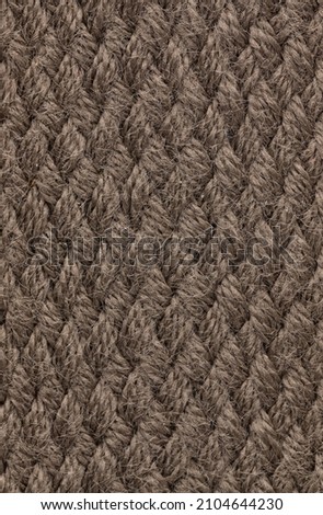 Knitted Textile texture off colored background. 
