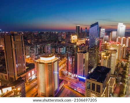 Aerial photography night view of modern city buildings in Qingda