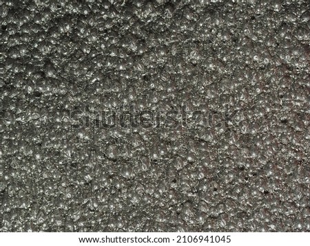 close up, background, texture, large horizontal banner. surface structure black expanded polyethylene, EPE, padding cushioning material for packages. full depth of field. high resolution photo