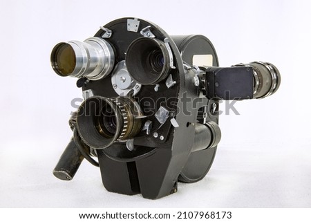 USSR vintage movie camera with three lenses on a white background