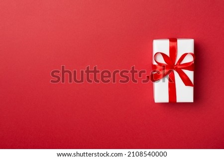 Top view of gift box on color background.