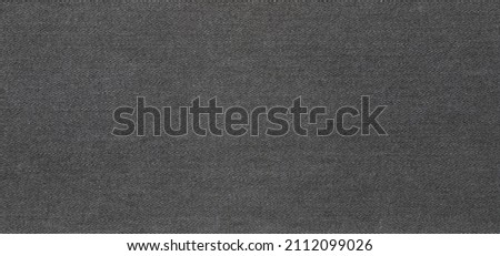 texture of black colored jeans denim fabric background