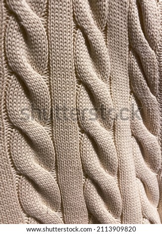 Background, texture, surface of wool knitted 

