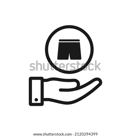 Short pants on hand. Clothing, fashion, apparel icon line style isolated. Vector illustration