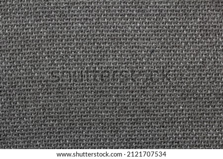 texture of coarse jacquard fabric with synthetic threads