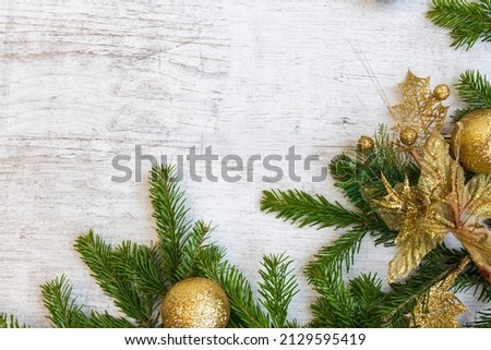 Christmas composition. Christmas tree decorations, fir tree branches on white wooden background. Flat lay, top view, copy space