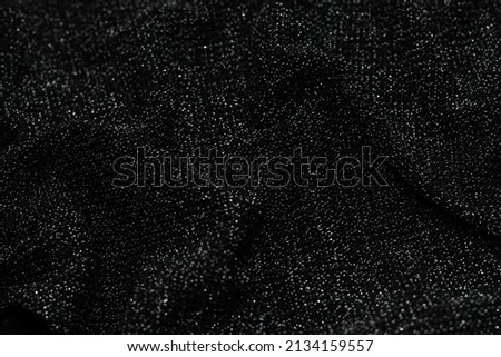 Texture of shiny lurex fabric silver and black color.