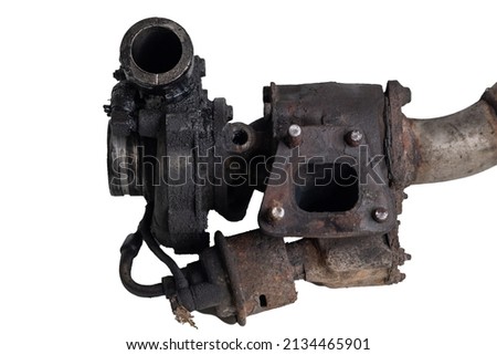 Old and worn car turbo charger. View of the flange on exhaust manifold, with broken nuts or screws. Turbo intake, oily and greasy on a white background.